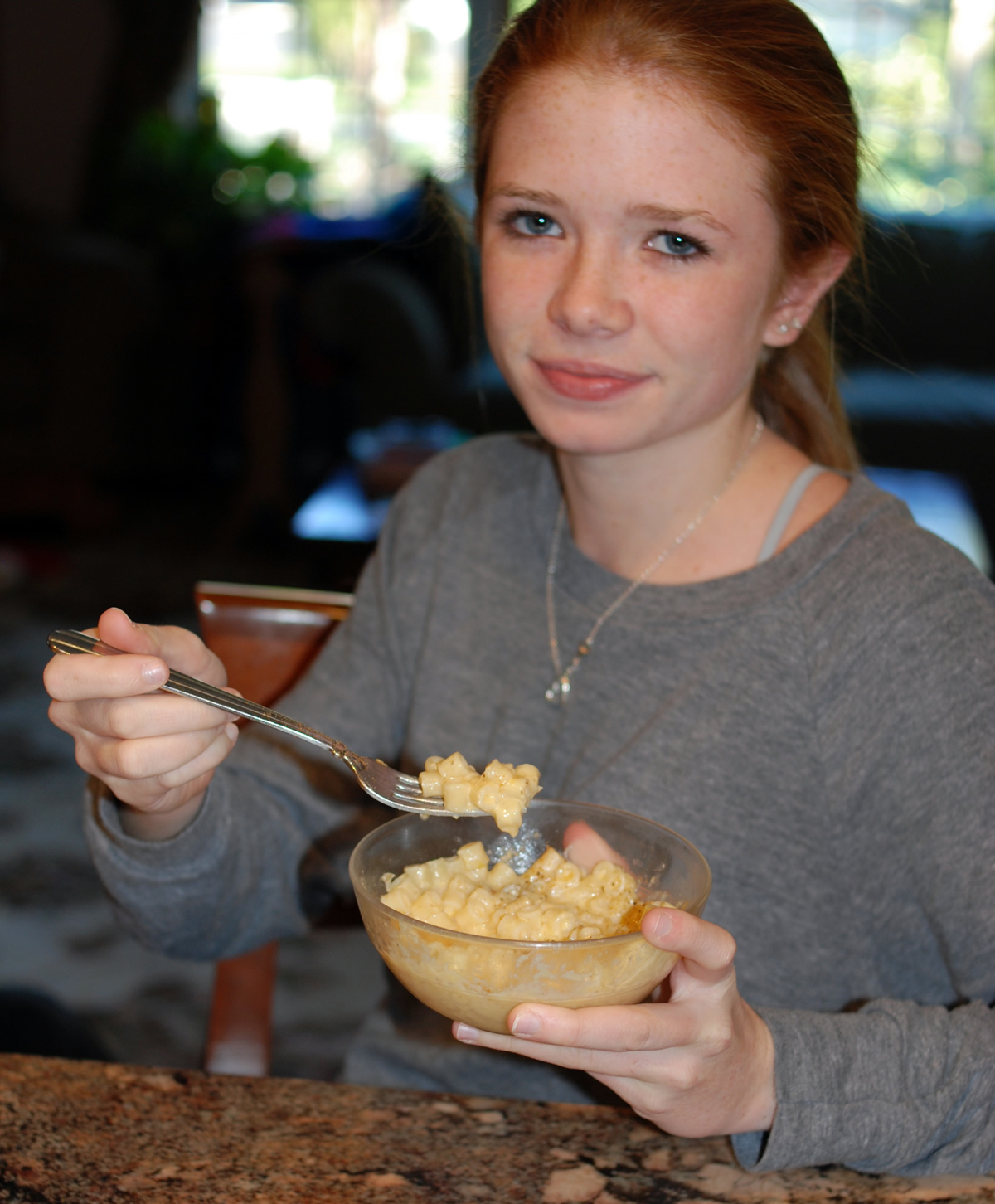 Daughter eating Mac and Cheese