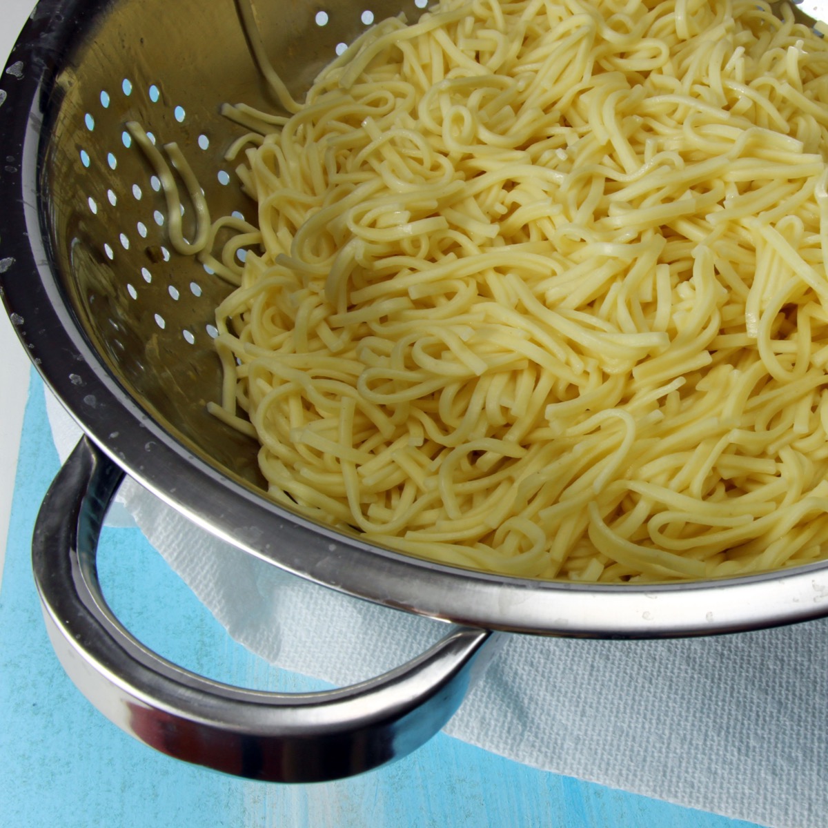 Draining Pasta in Colander