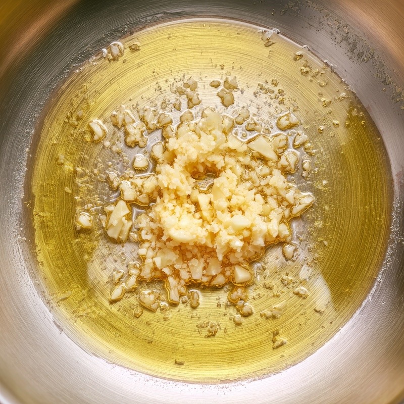 Minced Garlic Cooking in Extra Virgin Olive Oil