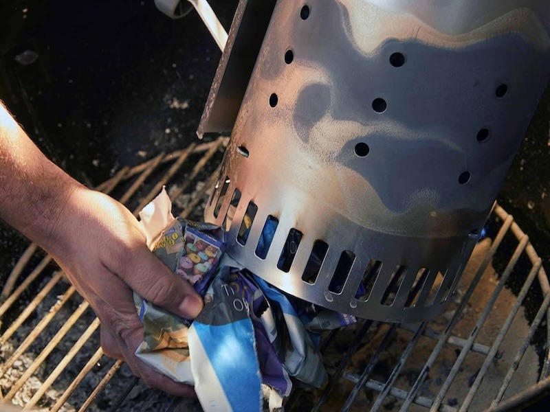 Charcoal Chimney Starter with Newspaper.