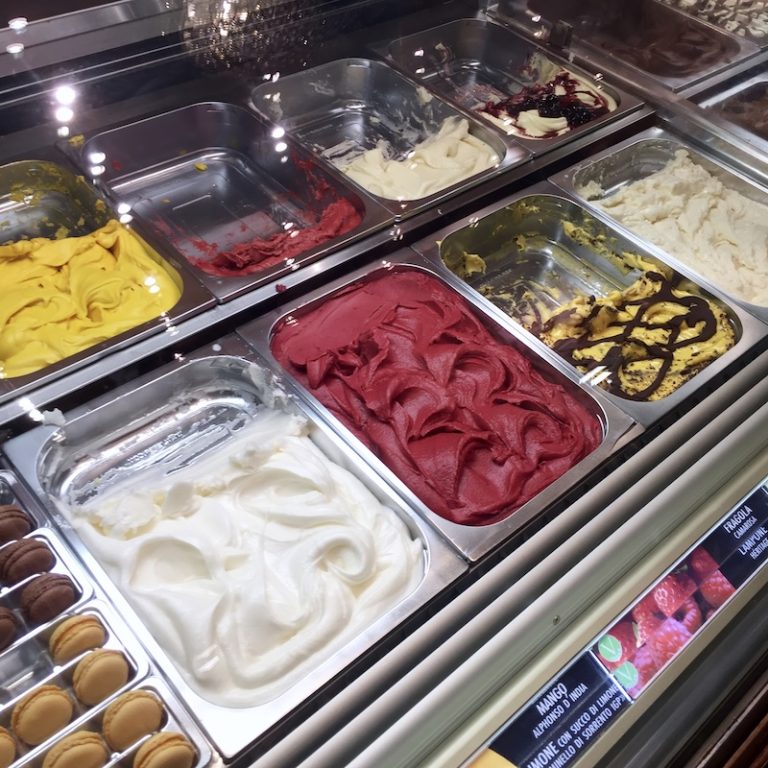 Gelato displayed at a gelato stand