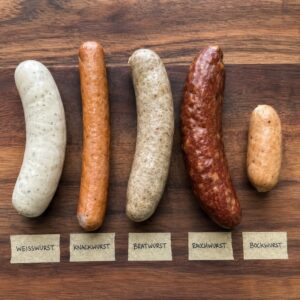A selection of german wursts on a wooden board