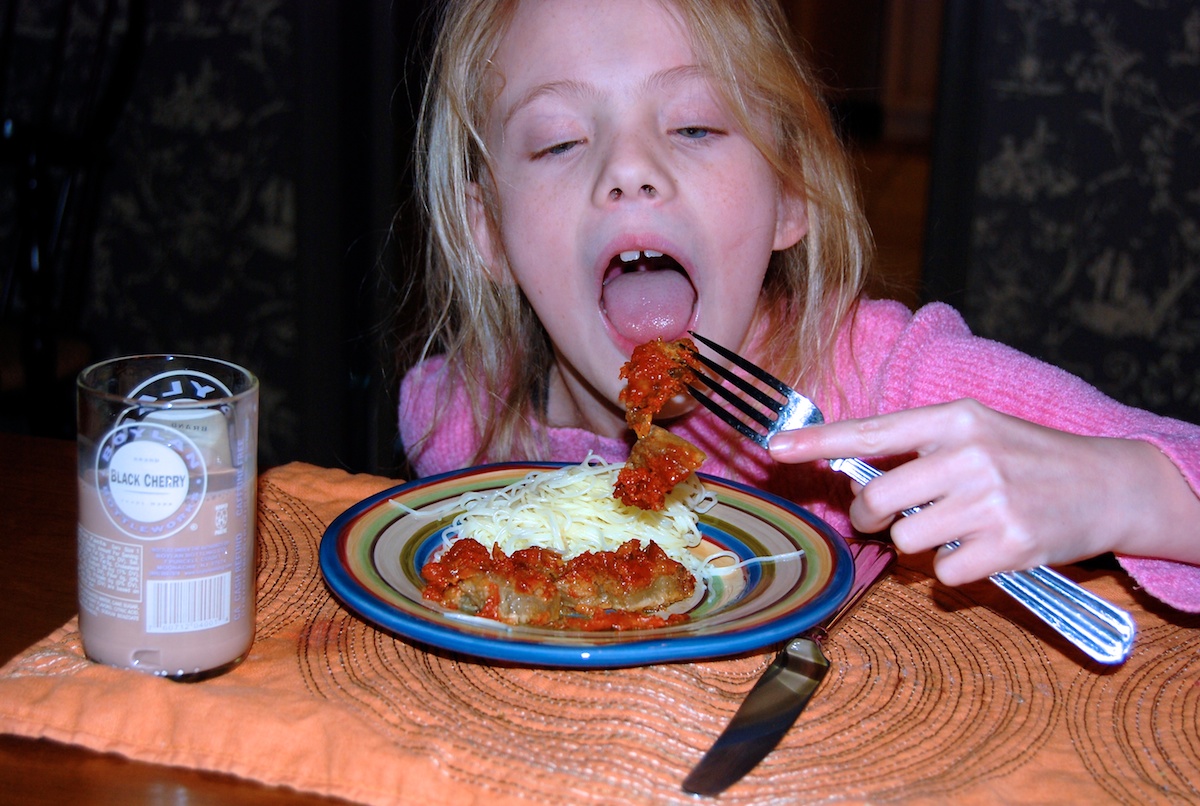 Maddie Enjoying Eggplant Parmesan