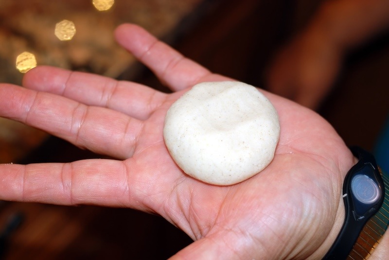 A small ball of masa in hand