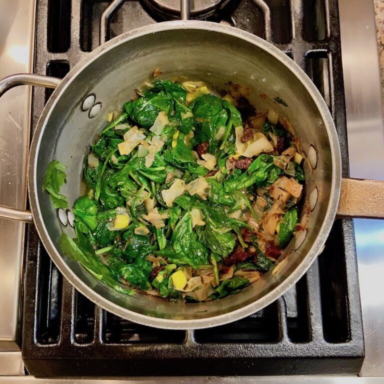 Wilting spinach in a soup pot