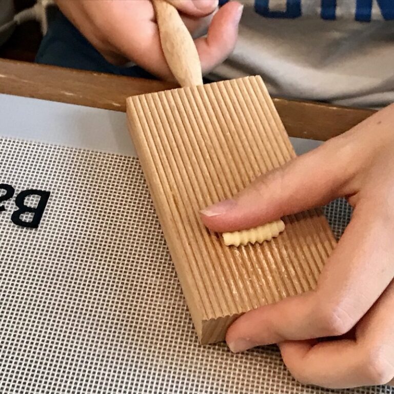 Making Cavatelli pasta on a wooden board