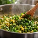 Adding basil to succotash