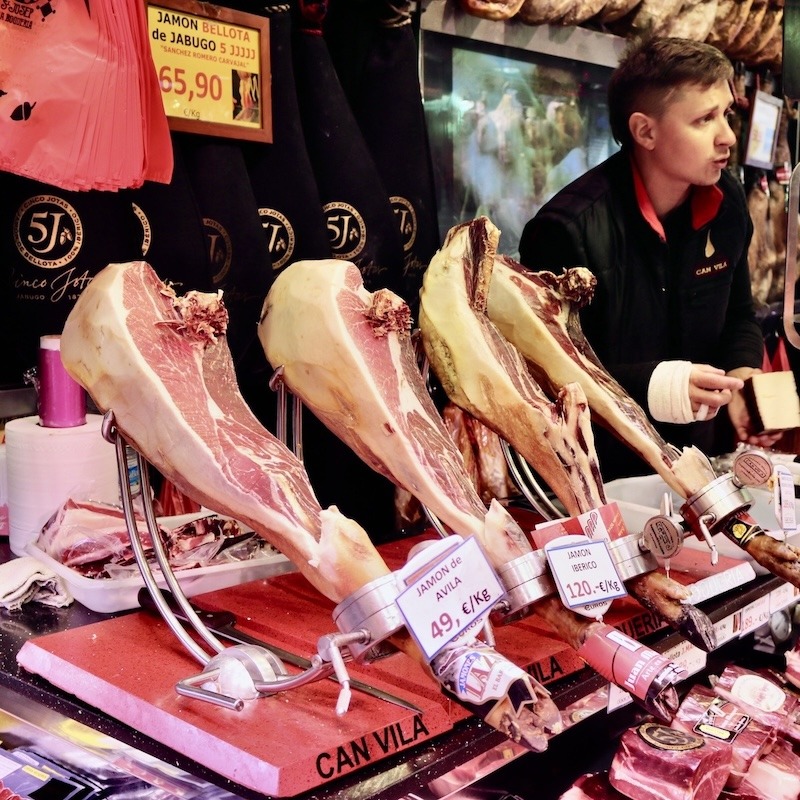A market in Spain displaying Jamon meats