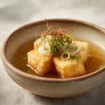 A bowl of perfectly cooked, deep fried agedashi tofu