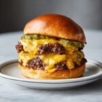 double smash burger with melted cheese, crispy edges