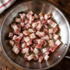 A saute pan with diced guanciale