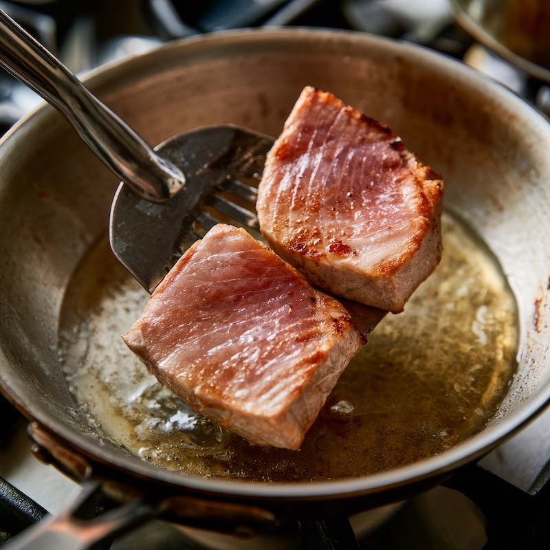 Two tuna pieces seared just opaque on the outside