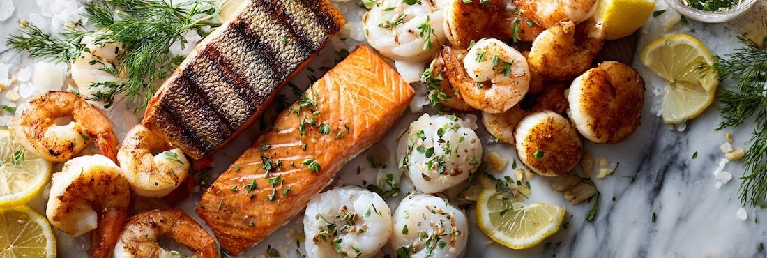 seafood spread on a light marble surface